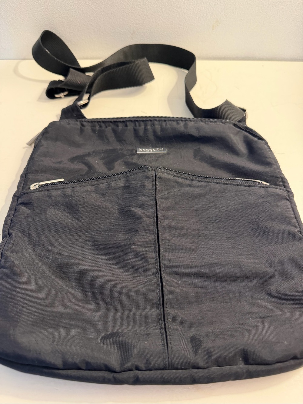 Baggallini black nylon “Horizon” crossbody bag.